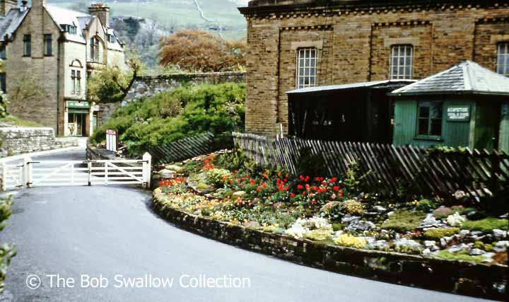 Settle Station drive, flower beds, coal merchants' office and tank house