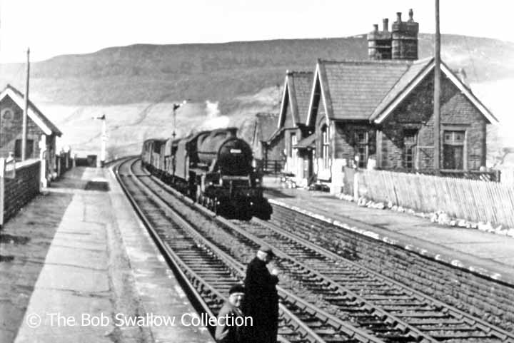 'Up' goods train passing Ribblehead Station prior to removal of 'Down' platform