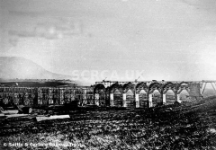 Ribblehead Viaduct under construction from NE, with navvy huts in foreground.