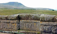 Ribblehead Viaduct: The track-facing south-western datestone (1875).