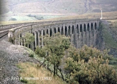 The northeast face of Ribblehead Viaduct, taken from southbound train looking NW.