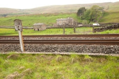 259510 Level Crossing - White Birch (disused): Elevation view from the east