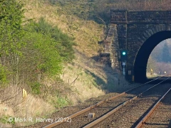 Mileposts 292½ (left), 292¼ (beyond tunnel) and 292 (right, glinting in sun).